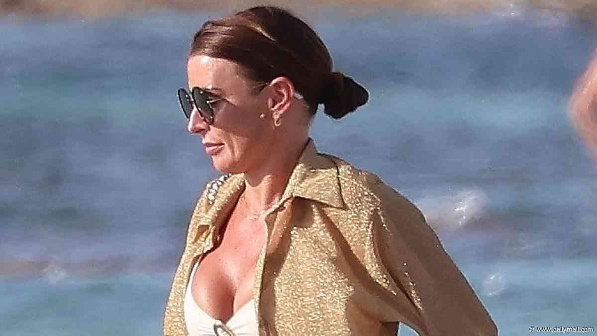 Coleen Rooney sizzles in a white bikini and £3,350 Chanel bag as she and Wayne enjoy a boat trip to Formentera on kid-free break with pals