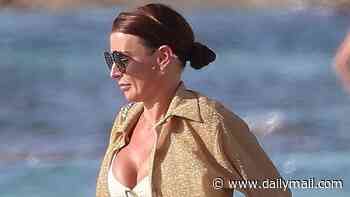 Coleen Rooney sizzles in a white bikini and £3,350 Chanel bag as she and Wayne enjoy a boat trip to Formentera on kid-free break with pals