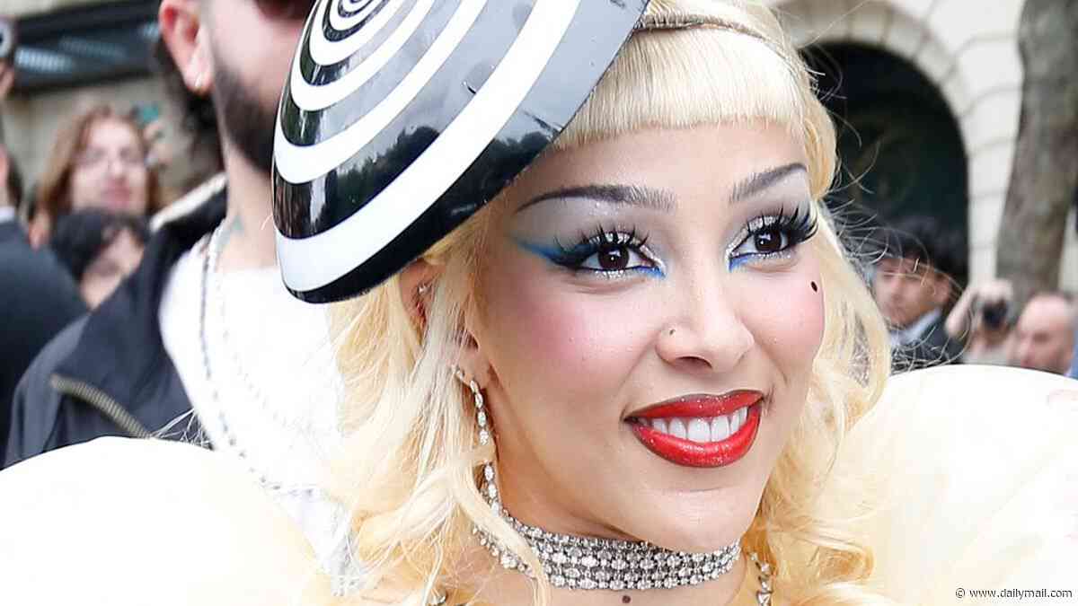Doja Cat shocks as she flashes her thong in an outlandish inflatable sheer dress with faux nipple piercings as she attends MAC event in Paris