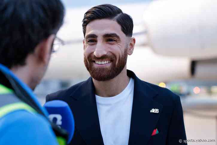 Iran’s World Cup players wear #168 lapel pins as they arrive in Mexico