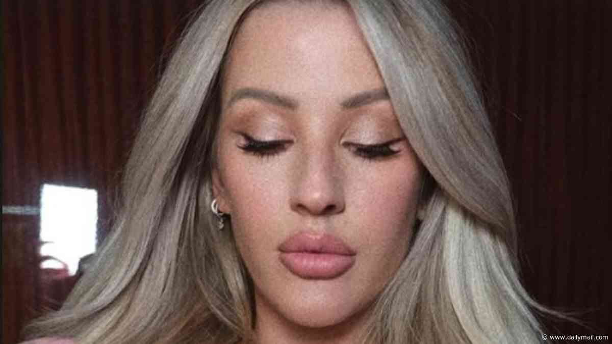 Ellie Goulding, 39, shares an intimate topless snap of Beau Minniear, 28, kissing her baby bump in touching pregnancy throwback