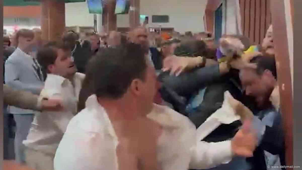 Moment brawl breaks out at Epsom Derby as punters throw punches in bloody fight