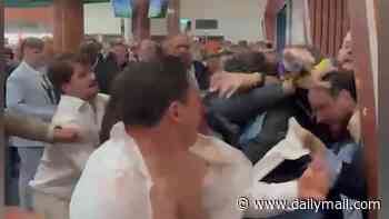 Moment brawl breaks out at Epsom Derby as punters throw punches in bloody fight