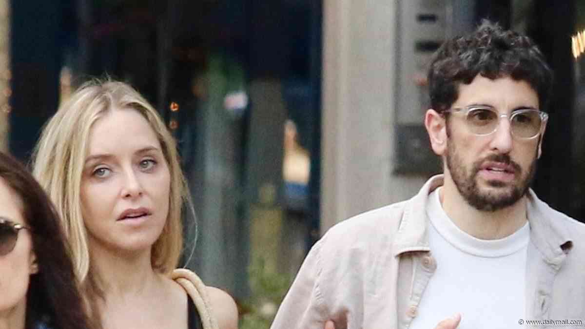Jason Biggs and estranged wife Jenny Mollen link arms in shock friendly display on first outing since marriage split