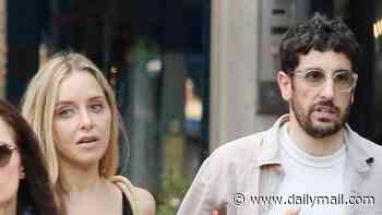 Jason Biggs and estranged wife Jenny Mollen link arms in shock friendly display on first outing since marriage split