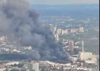Huge fire at London recycling centre sparks rail chaos and sends smoke billowing across city skyline
