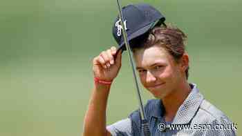Teen Russell, with Tiger's son on bag, makes Open