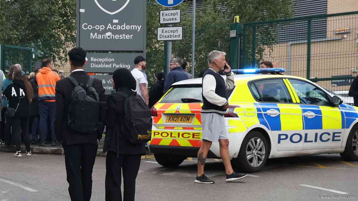 Hero teacher stabbed in neck as he protected children from knife-wielding schoolgirl: Police arrest 14-year-old suspect after two pupils were injured in classroom attack