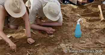 Dozens of 7,000-year-old headless human skeletons found in ditch