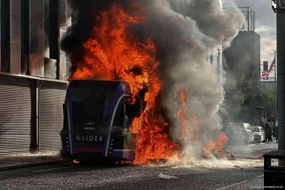 Bus set alight by masked protesters as police dealing with ‘pockets of disorder’