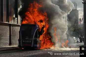 Bus set alight by masked protesters as police dealing with ‘pockets of disorder’