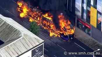 Bus set alight in Belfast during riots after a stabbing attack