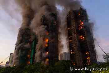 Hong Kong charges 7 people and 2 firms over deadly fire that killed 168