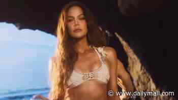 Khloe Kardashian makes out with a hunky shirt-free man on the beach as she releases her third fragrance