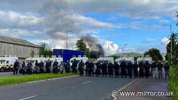 Belfast attack live: Protesters blasted with water cannon during second night of violence