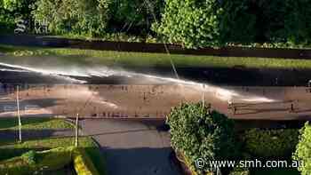 Police unleash water cannon on protesters near Belfast