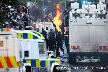 Rioting breaks out for second night near Belfast as masked protesters clash with police