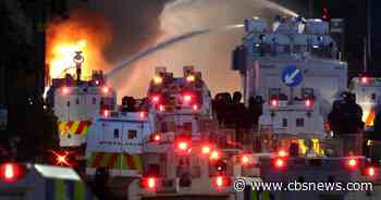 Belfast protests erupt again after stabbing as police deploy water cannons