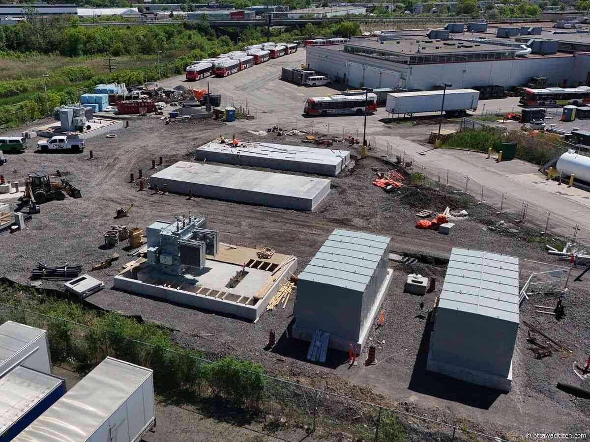 Why is OC Transpo installing natural gas generators for a zero-emission bus project?