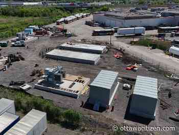 Why is OC Transpo installing natural gas generators for a zero-emission bus project?