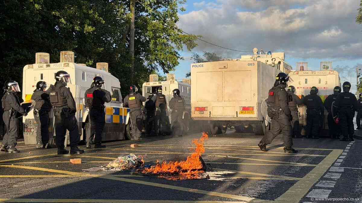 MP slams 'racist thuggery' in Belfast unrest as bricks and petrol bombs injure 12 officers