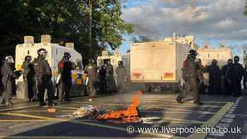 MP slams 'racist thuggery' in Belfast unrest as bricks and petrol bombs injure 12 officers