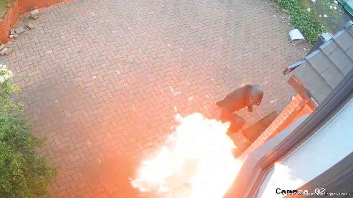Moment Bolton imam's family home is 'firebombed' by masked criminal in terrifying attack