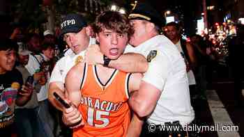 Pandemonium in New York as Knicks fans flood the streets after historic comeback - as supporters SMASH yellow cabs and light explosives while waving Palestinian flags
