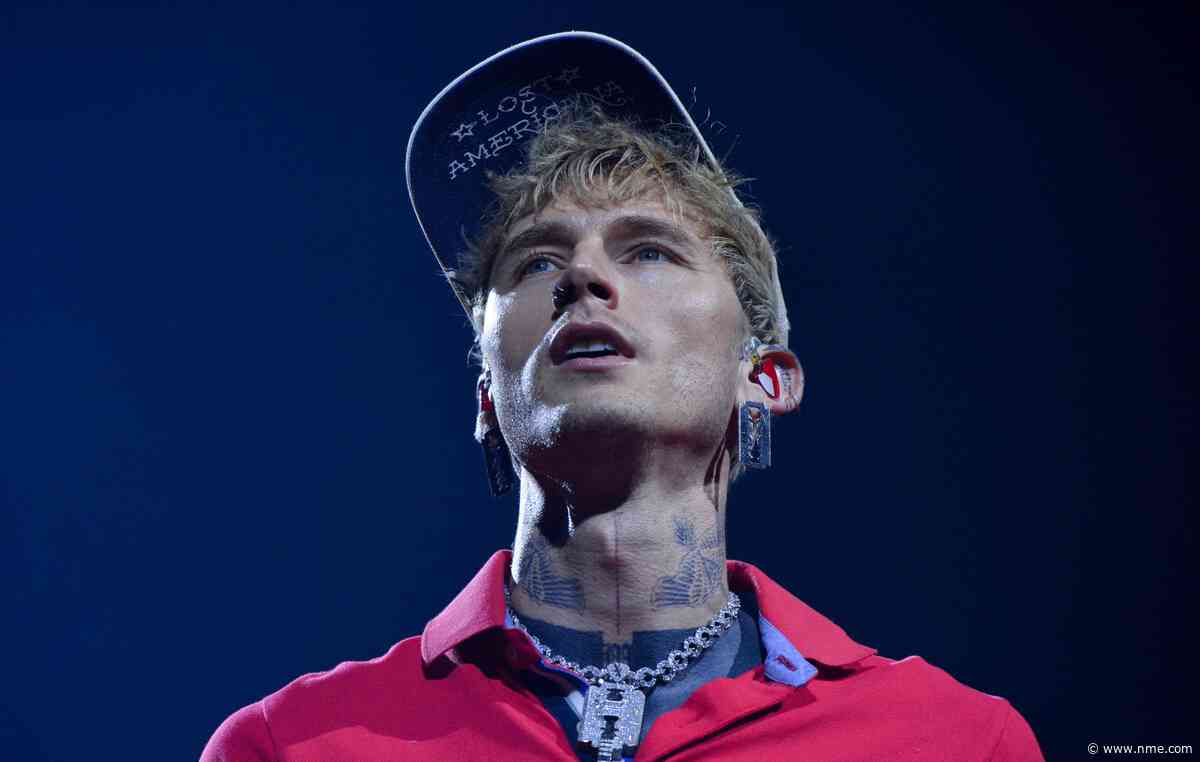 Watch MGK “mess my back up really, really bad” as he somersaults off roof into audience