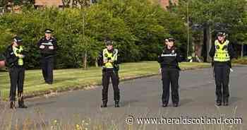 Two arrested after protestors target police officers and vehicles