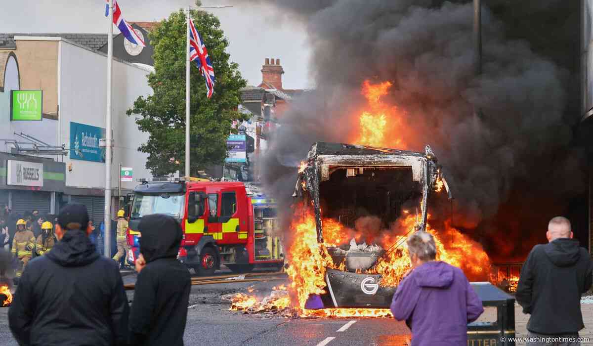 Belfast riots spread to second night as police deploy water cannons
