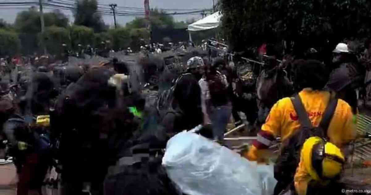 Riot police clash with protesters hurling stones outside World Cup opening ceremony 