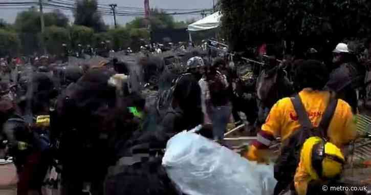 Riot police clash with protesters hurling stones outside World Cup opening ceremony 