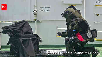 Navy removes unexploded warhead from struck ship