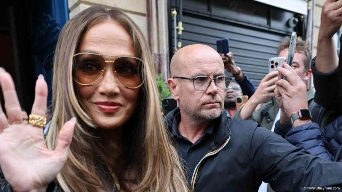 Jennifer Lopez looks chic in a pinstripe suit as she heads to David Guetta's show in Paris after revealing which Hollywood stars she wants to sleep with
