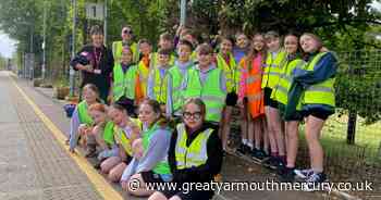 Community groups working on wildlife garden at Norfolk station