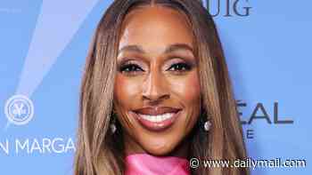 Alexandra Burke shows off her slimmed-down figure in a pink satin gown as she graces the blue carpet at the Fragrance Foundation Awards