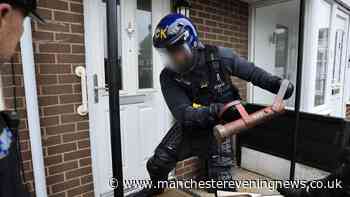 Police burst down doors of Salford homes as 43 people arrested