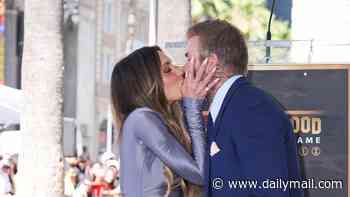 Sir David Beckham and Victoria passionately kiss as he unveils his Hollywood Walk of Fame star alongside A-lister pal Tom Cruise