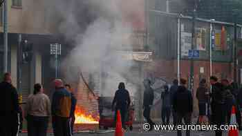 Cars and homes burn as unrest erupts in Belfast after knife attack