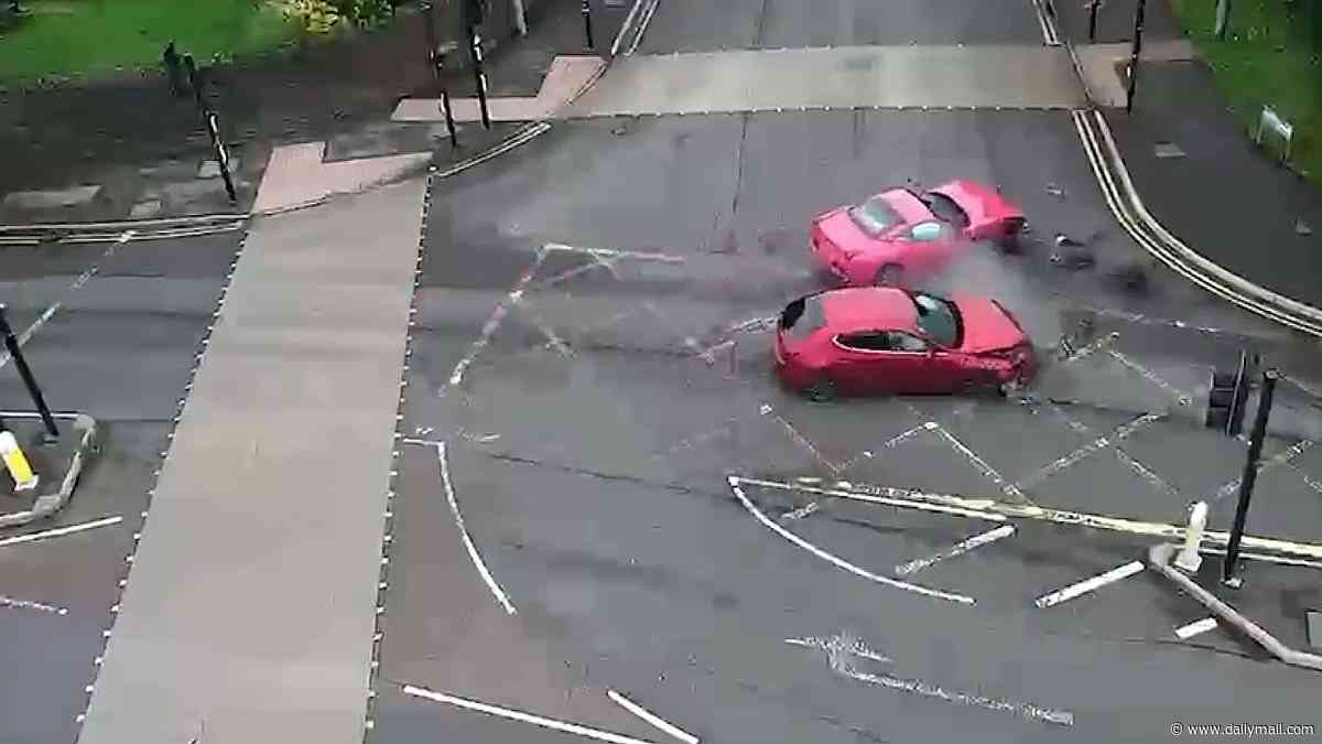 Moment Britain's only pink £120,000 Ferrari owned by 'Barbie-obsessed' woman is sent flying after being hit by car at junction