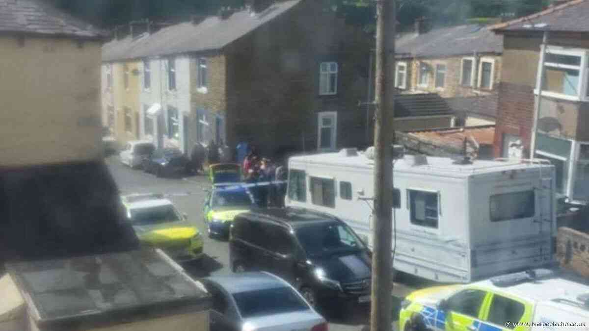 Armed police swarm street after girl, 17, stabbed in neck in Lancashire