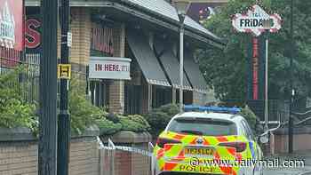 Body of man, 55, is found inside empty TGI Friday's restaurant as police launch murder probe: Two women aged 35 and 54 are arrested