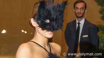 Naughty kitty! Kanye's wife Bianca Censori is bra and underwear free in a VERY sheer gown with a CAT mask