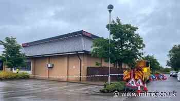Body of man, 55, found inside derelict TGI Fridays restaurant as police launch murder probe