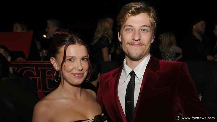 Millie Bobby Brown defends husband Jake Bongiovi after critics blast him for not helping with their bags