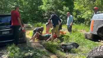 Moment missing woman rescued by Good Samaritans after being stuck in muddy puddle for three days in US