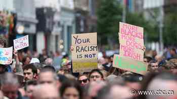 Thousands rally in Northern Ireland to condemn anti-immigration rioting