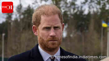 Prince Harry reacts as the royal family attends Trooping the Colour without him and Meghan Markle