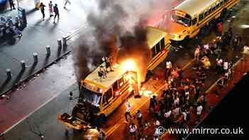 New York chaos as shots fired with buses torn apart and torched in Times Square